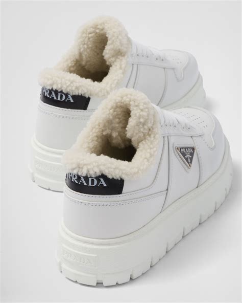 prada leather and shearling sneakers.